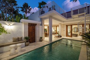 A modern house with a swimming pool, a balcony, and a staircase. - Modern Villa 2BR Casa Azuca by OriVista (Canggu)