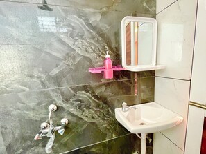 Shower, rainfall showerhead, bidet, towels - Hotel T P Inn near Mahakaleshwar Temple (Ujjain)