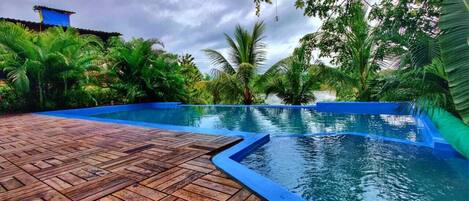 Outdoor pool, open 9:00 AM to 7:30 PM, pool umbrellas