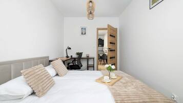 1 bedroom, desk, iron/ironing board, travel crib