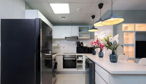 Coffee/tea maker, fridge, microwave, oven - Serene Beachside Two-Bedroom Retreat (Dubai)