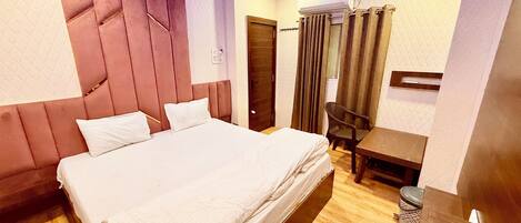 Premium bedding, desk, laptop workspace, free WiFi