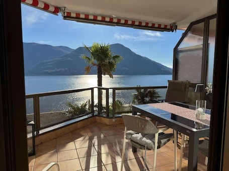 Outdoor dining. Brissago Lake & Pool Studio –Lake View+Indoor Pool