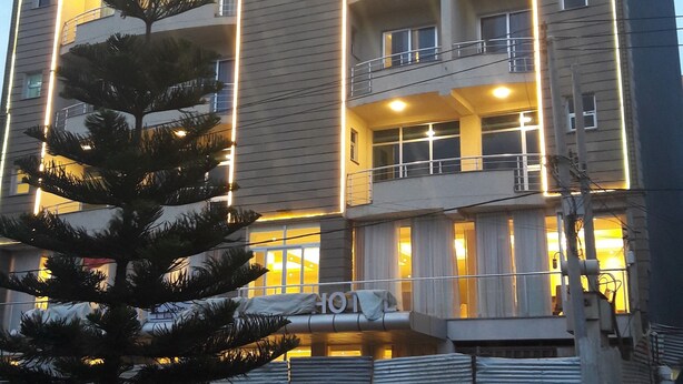 A multi-story hotel with balconies and a sign indicating it is a hotel. - Libanos Hotel (Mek'ele)