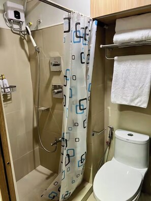 Shower, bidet, towels, soap - Shore 3 Comfy & Cozy 1BR unit near MOA (Pasay City)