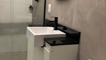 Shower, towels, soap, toilet paper