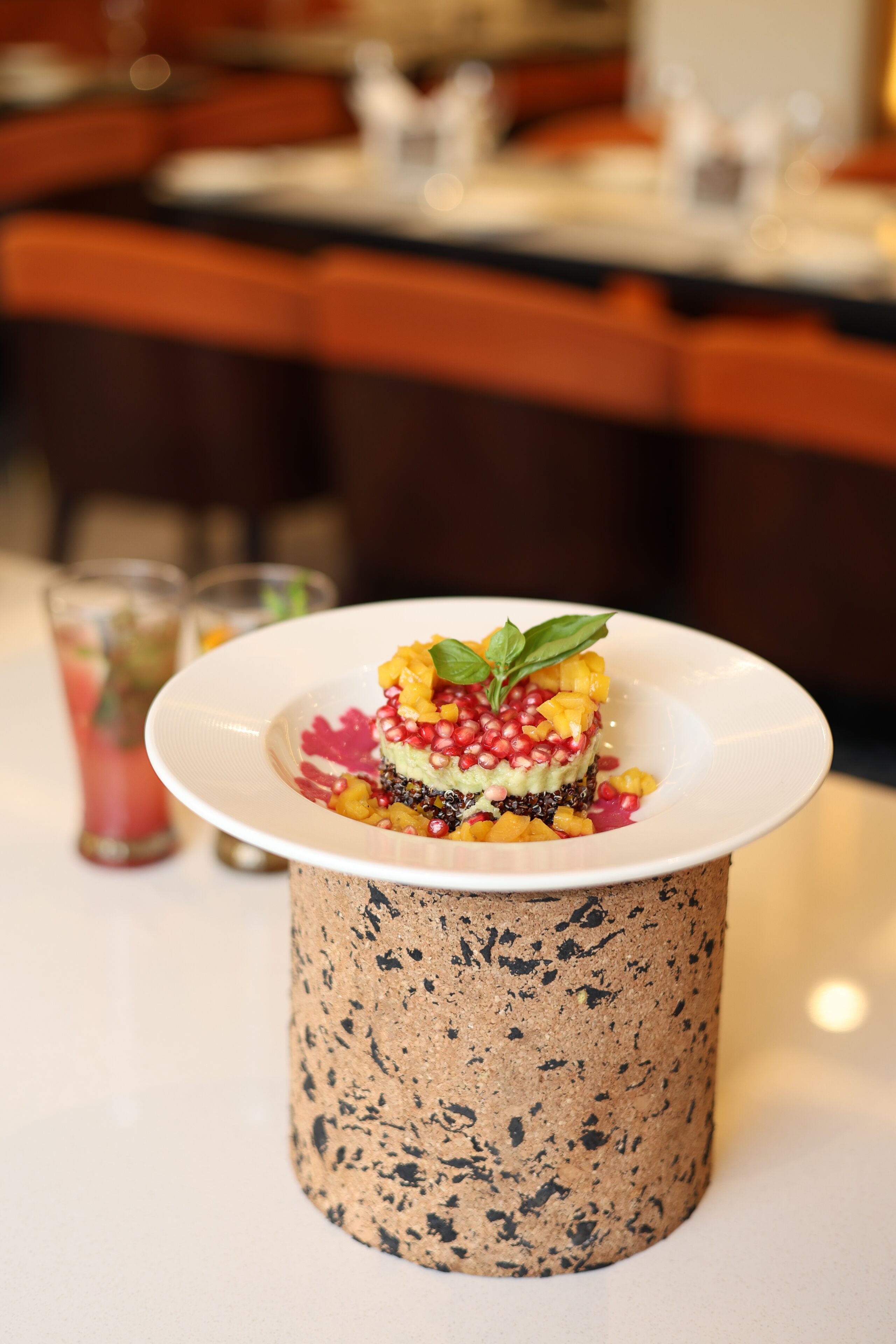 A dessert on a white plate with a textured base.