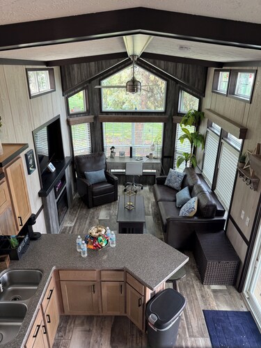 MTM Premier - The Funky Duo combines Funky Island and Funky Jungle—two side-by-side lakefront properties sleeping 12 total. A bright park model and cozy log cabin with shared campground amenities, perfect for larger groups.