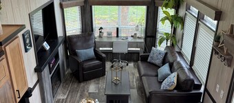 MTM Premier - The Funky Duo combines Funky Island and Funky Jungle—two side-by-side lakefront properties sleeping 12 total. A bright park model and cozy log cabin with shared campground amenities, perfect for larger groups.