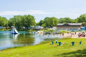 Beach - MTM Premier - The Funky Duo combines Funky Island and Funky Jungle—two side-by-side lakefront properties sleeping 12 total. A bright park model and cozy log cabin with shared campground amenities, perfect for larger groups. (Portage)