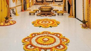 A spacious room with a central seating area, ceiling fans, and decorative lighting. - The Golden Taj Vrindavan (Vrindavan)