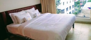 Deluxe Double Room, City View | Desk, laptop workspace, iron/ironing board, free WiFi - Hotel Amulya Royal Inn  (Bengaluru)