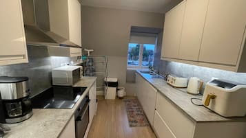 Deluxe Apartment, 2 Bedrooms | Private kitchen | Fridge, microwave, oven, dishwasher