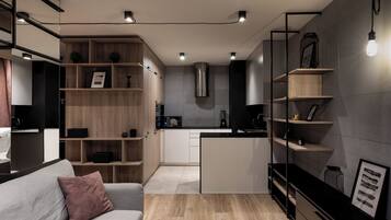 Superior Apartment, Air conditioning | Living area | Flat-screen TV