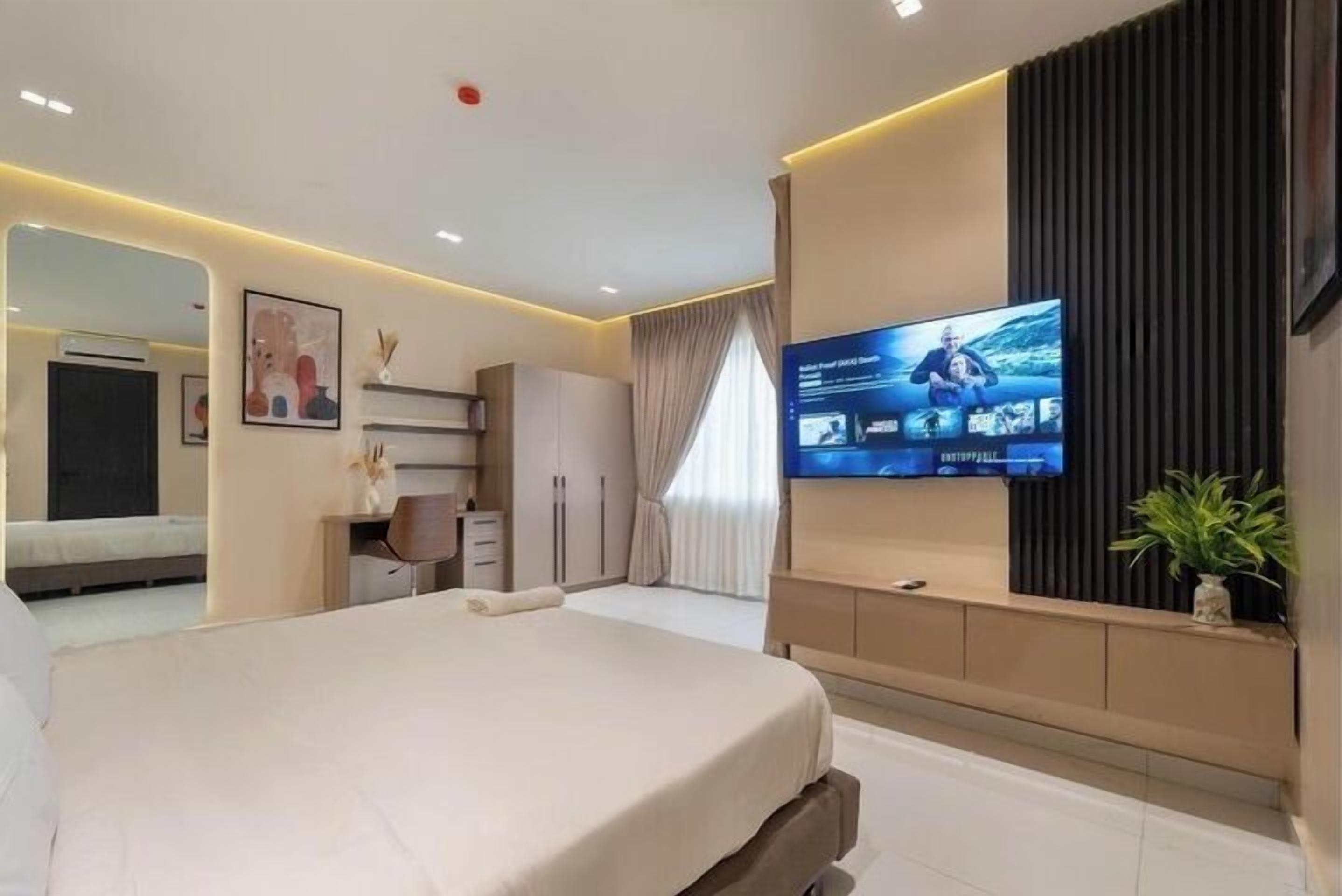 Family Apartment, Balcony, City View | Desk, laptop workspace, blackout drapes, soundproofing