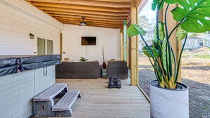 A covered porch with a wooden ceiling, a bench, a table, and a potted plant. - Artists Retreat w/ Deck! 5 Mi to Dtwn Durham (Durham)