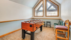 A room with a foosball table, a small table, and two chairs. - Walk to Ski Lift & Hot Tubs! Mtn-view Keystone Gem (Keystone)