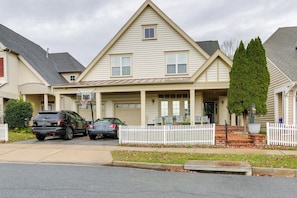 A two-story house with a front porch, a garage, and a driveway with two cars parked. - Clarksburg Getaway Near DC + Baltimore Sights! (Clarksburg)