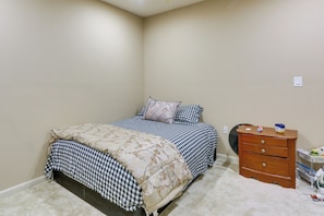 A bedroom with a bed, a dresser, and a carpeted floor. - Clarksburg Getaway Near DC + Baltimore Sights! (Clarksburg)