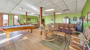 A pool table in a room with green walls, wooden chairs, and a sofa. - 100-acre Family Getaway in Kenbridge: Pets Welcome (Kenbridge)