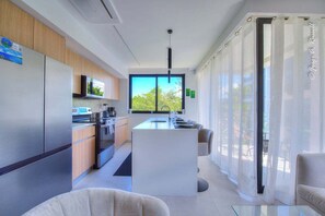 Fridge, microwave, oven, stovetop - Cozy and Bright 2BR Apt at Torres del Mar (Jacó, Torres del Mar)