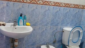 A bathroom with a sink, a toilet, and a bidet. - Clean & Cozy Room in Aïn Chock, Casa Nearshore (Casablanca)