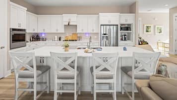 Full-sized fridge, microwave, stovetop, cookware/dishes/utensils