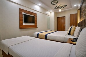 Family Triple Room, City View | Desk, laptop workspace, free WiFi - Glitz Hotel Sai Neel (Mumbai)