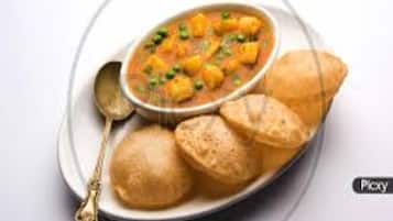 Bữa sáng đặc sản địa phương hàng ngày (200 INR/mỗi người)