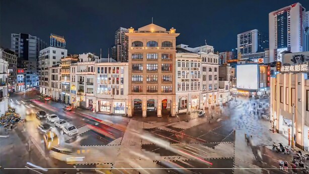 A city square with a prominent historic building in the center, surrounded by modern high-rises. - Yueduo Selected Hotels (Guangzhou)