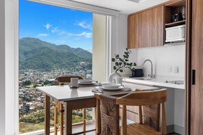Panoramic Studio, Balcony, Partial Sea View | Private kitchen - Amazing Apartments - Hotel Zone (Puerto Vallarta)