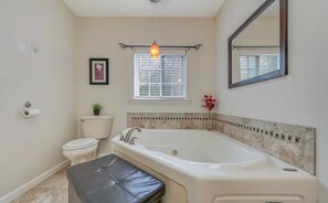 Jetted tub, hair dryer, towels, soap