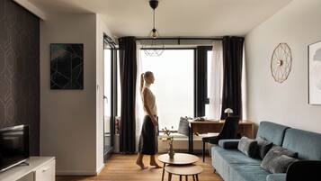 Superior Apartment, Balcony, River View | Living area | Flat-screen TV