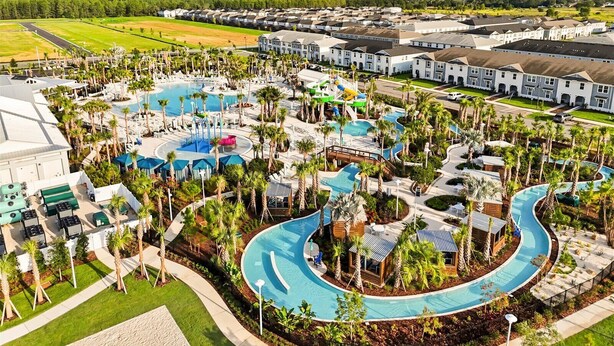 A resort with multiple swimming pools, palm trees, and residential buildings. - Mario | Minions | Theater | Private Pool | Disney 15883 (Clermont)