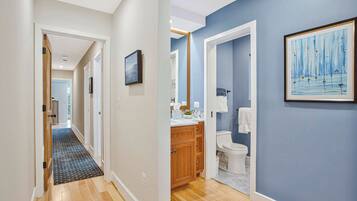 Shower, hair dryer, towels, shampoo