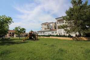 Children’s area - Idyllic apartment with children's playground in front of the building and only 700 metres from the beach (Porec)