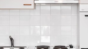 A modern kitchen with white cabinets, a Siemens range hood, and a stainless steel sink. - Comfortable Studio in Le Touquet Near Beach (Le Touquet-Paris-Plage)