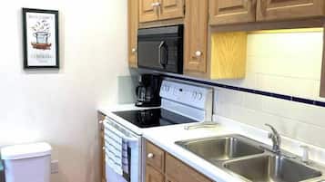 Fridge, coffee/tea maker, cookware/dishes/utensils