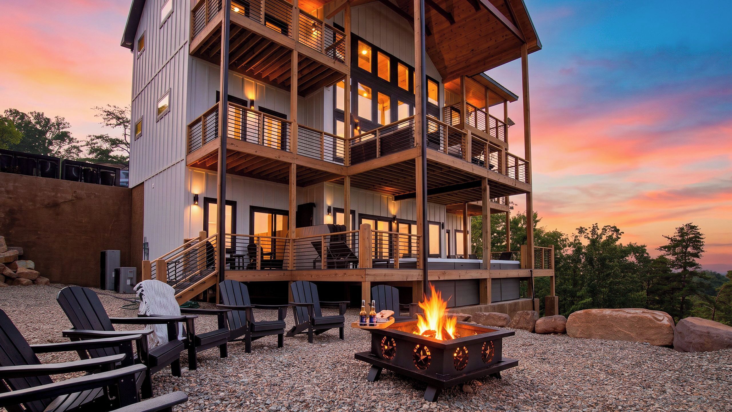 A multi-level building with outdoor seating and a fire pit.