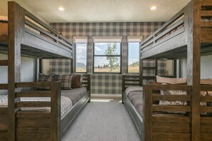 A bunk bed room with a view of the outdoors. - 4BR Deer Valley East | Hot Tub | Shuttle + Views (Wasatch County)