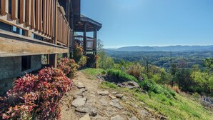A wooden building with a balcony overlooking a mountainous landscape. - Mountain Views, Family Getaway, Pet Friendly, Game Room, Sleeps 9 (Sevierville)