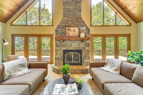 NEW LISTING! Timber Ridge Lake House is a private lake home in Amery Wisconsin on Lake Wapogasset. The home balances the warmth of a large A-Frame with modern decor and finishes providing a serene stay with woods and lake views.