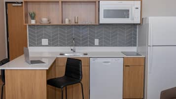 Full-sized fridge, microwave, stovetop, dishwasher