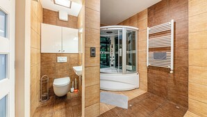 A modern bathroom with a glass-enclosed shower, a white sink, and a toilet. - La Dolce Vita –Massage Shower Stay W/ Ac + Balcony (Budapest)