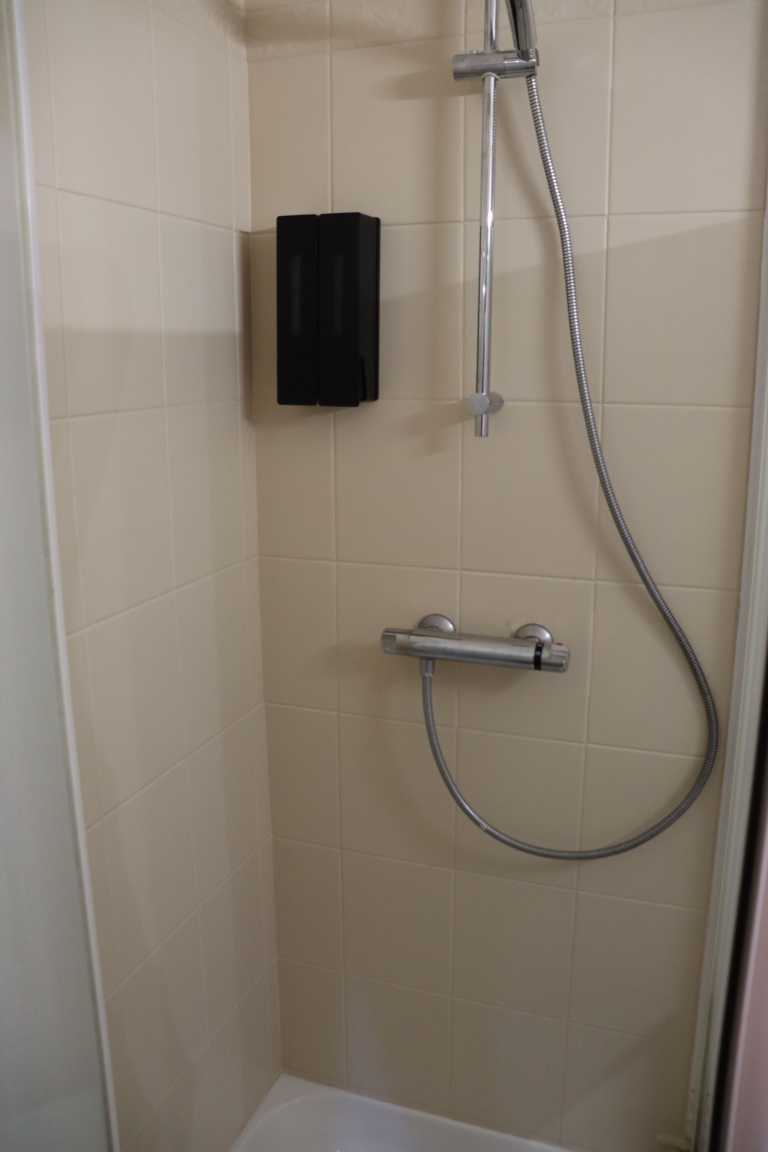 Jetted bath, hair dryer, towels, toilet paper
