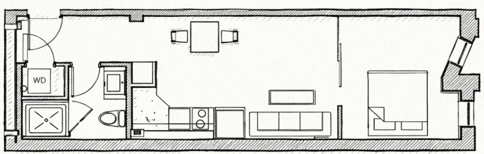 Plano de un cuarto de hotel con inodoro, cama, televisor y una pequeña kitchenette.