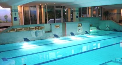 Cozy apartment with Alpine view + Balcony +POOL +Netflix +SAUNA +GYM