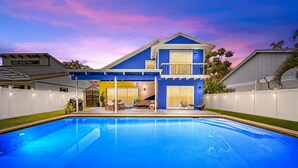 A two-story house with a swimming pool, white fence, and a balcony. - Sunset Haven w/ Saltwater Pool, Arcade Mins to Beach (Delray Beach)
