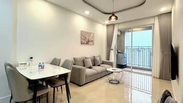 Deluxe Apartment, 2 Bedrooms, Non Smoking, City View | Living area | 24-inch flat-screen TV with digital channels