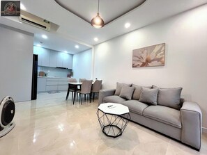 Deluxe Apartment, 2 Bedrooms, Non Smoking, City View | Living area | 24-inch flat-screen TV with digital channels - Sunrise City Premium Urban Residence (Thanh Pho Ho Chi Minh)